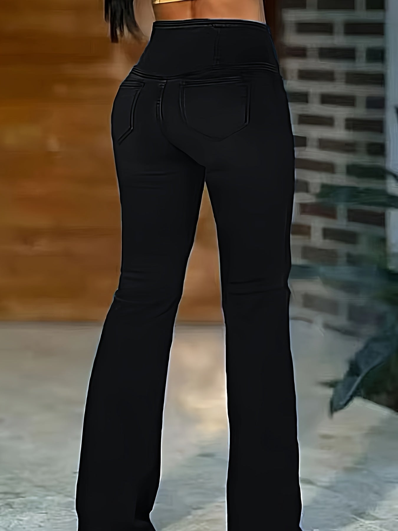 WL Atelier | Elegant High-Waist Black Flare Jeans with Cross-Front Detail