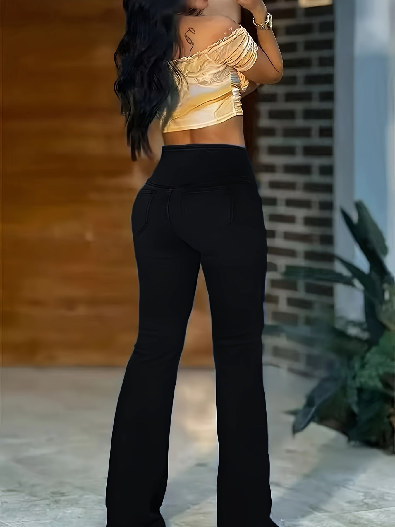WL Atelier | Elegant High-Waist Black Flare Jeans with Cross-Front Detail