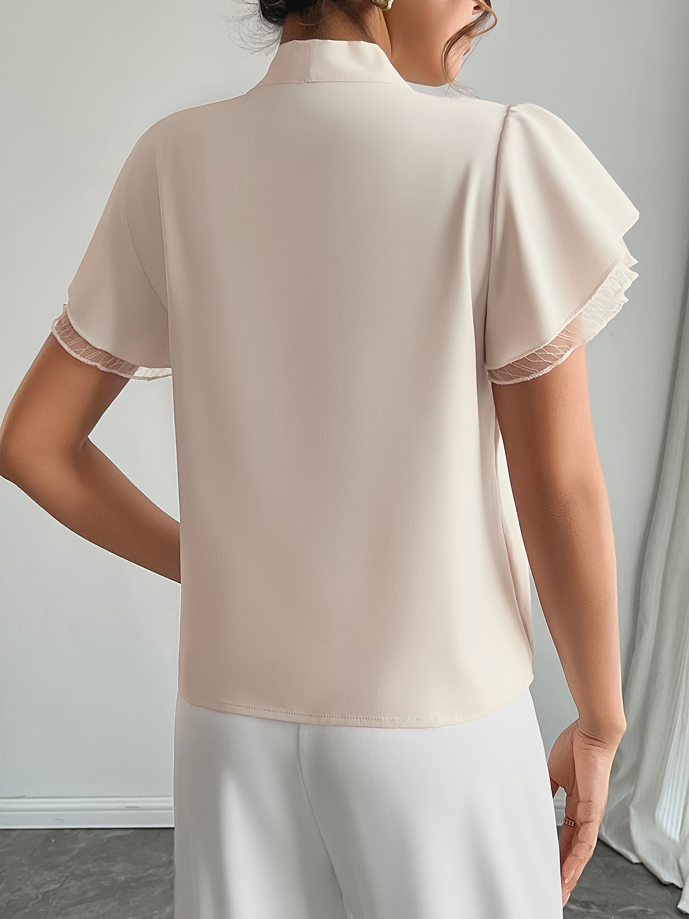Soft Beige Tie-Neck Blouse with Ruffled Elegance