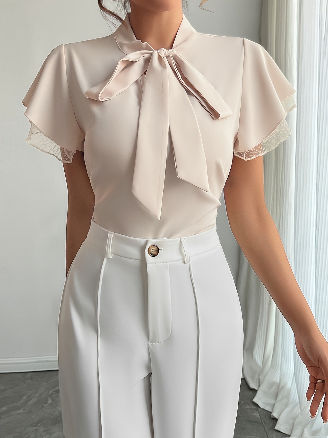 Soft Beige Tie-Neck Blouse with Ruffled Elegance