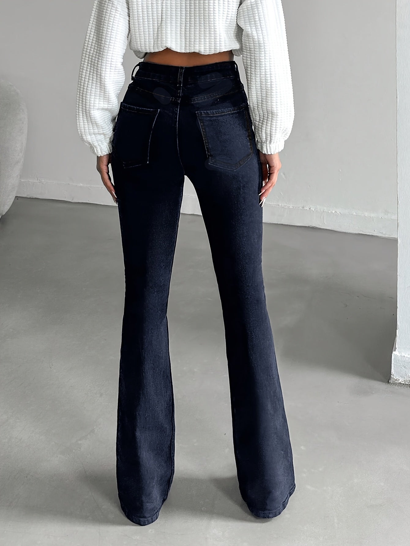 WL Atelier | Elegant High-Waisted Flare Jeans with Button Detail