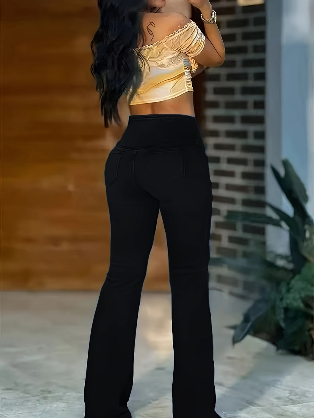 WL Atelier | Elegant High-Waist Black Flare Jeans with Cross-Front Detail